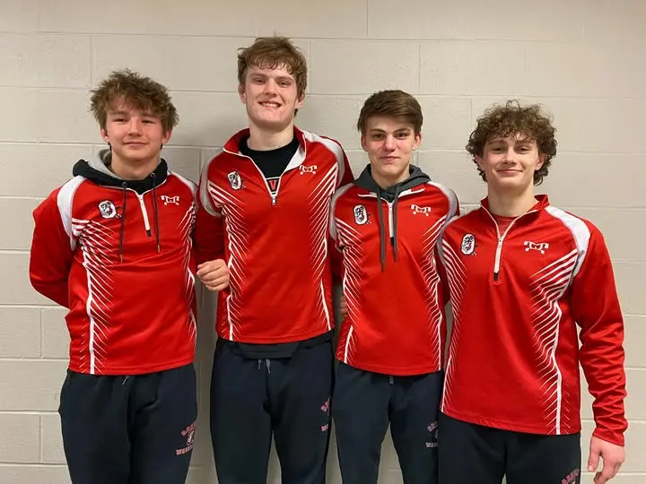 Owen Landis with Orrville High School wrestling teammates after qualifying for districts